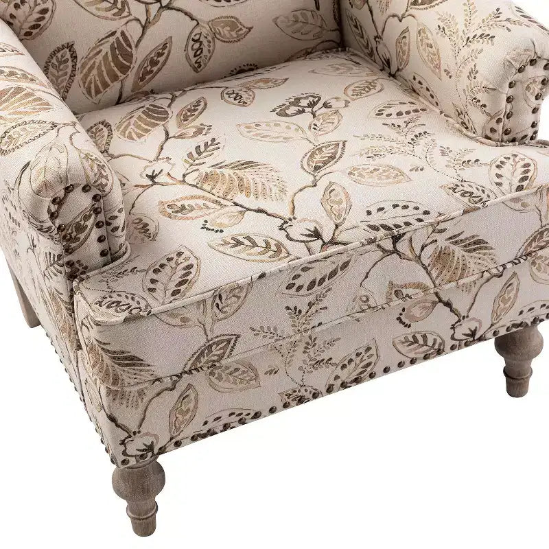 Wooden Upholstered Floral Pattern Armchair with Panel Arms and Camelback
