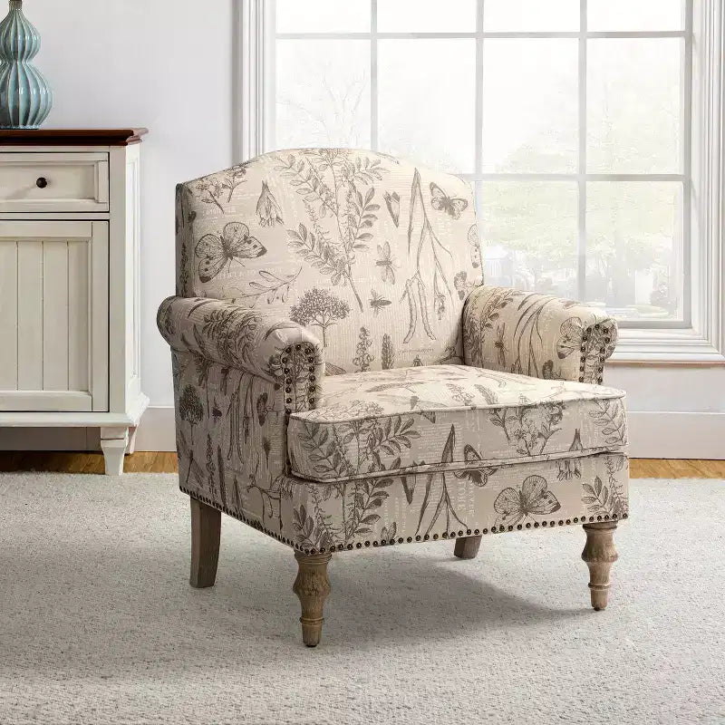 Wooden Upholstered Floral Pattern Armchair with Panel Arms and Camelback