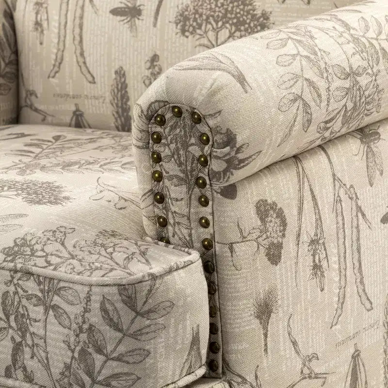 Wooden Upholstered Floral Pattern Armchair with Panel Arms and Camelback