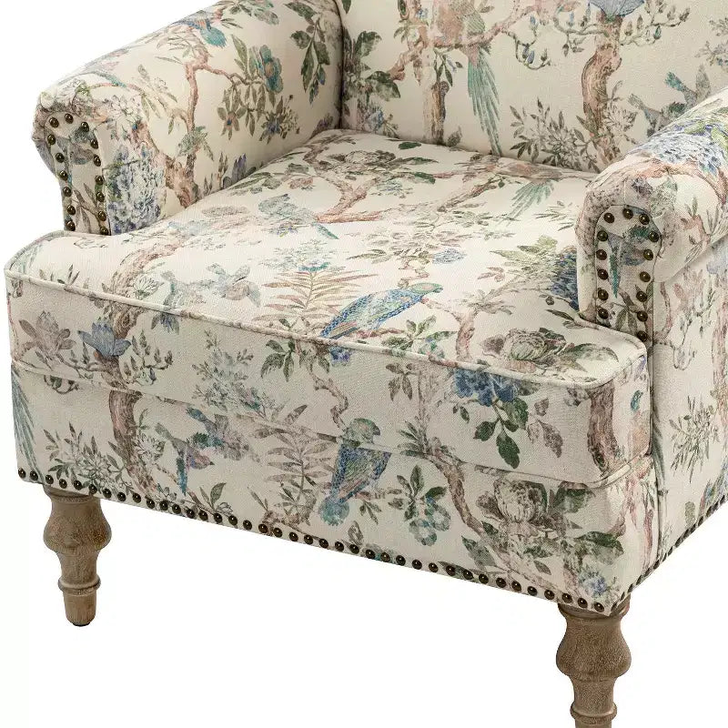 Wooden Upholstered Floral Pattern Armchair with Panel Arms and Camelback