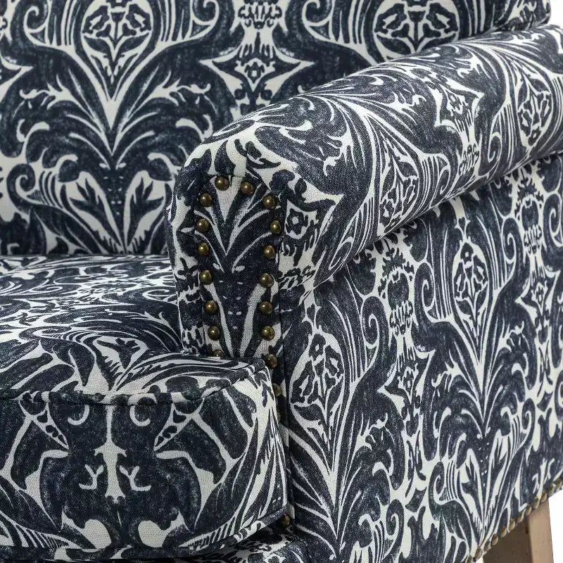 Wooden Upholstered Floral Pattern Armchair with Panel Arms and Camelback
