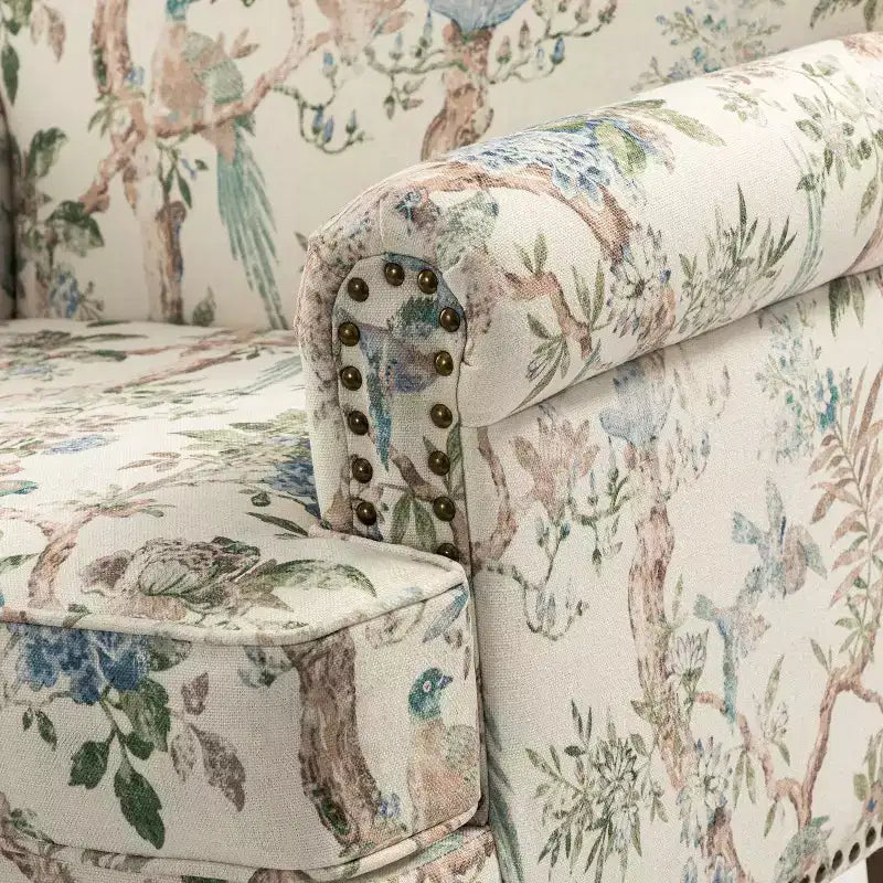 Wooden Upholstered Floral Pattern Armchair with Panel Arms and Camelback