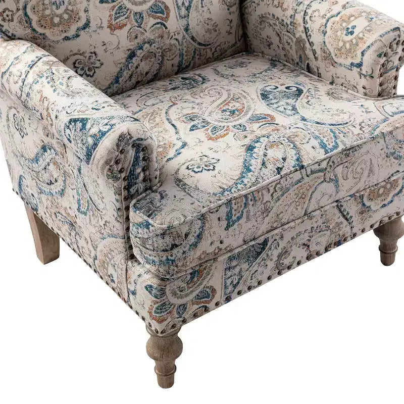 Wooden Upholstered Floral Pattern Armchair with Panel Arms and Camelback