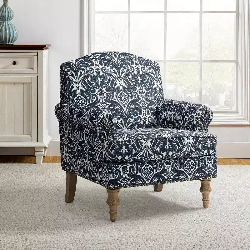 Wooden Upholstered Floral Pattern Armchair with Panel Arms and Camelback